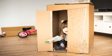 KiwiSaver Playing In Cardboard Box