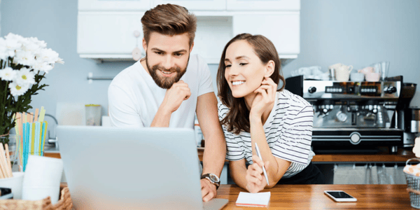 Couple looking at computer featured image