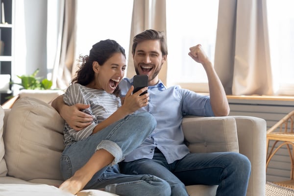 Overjoyed surprised young couple